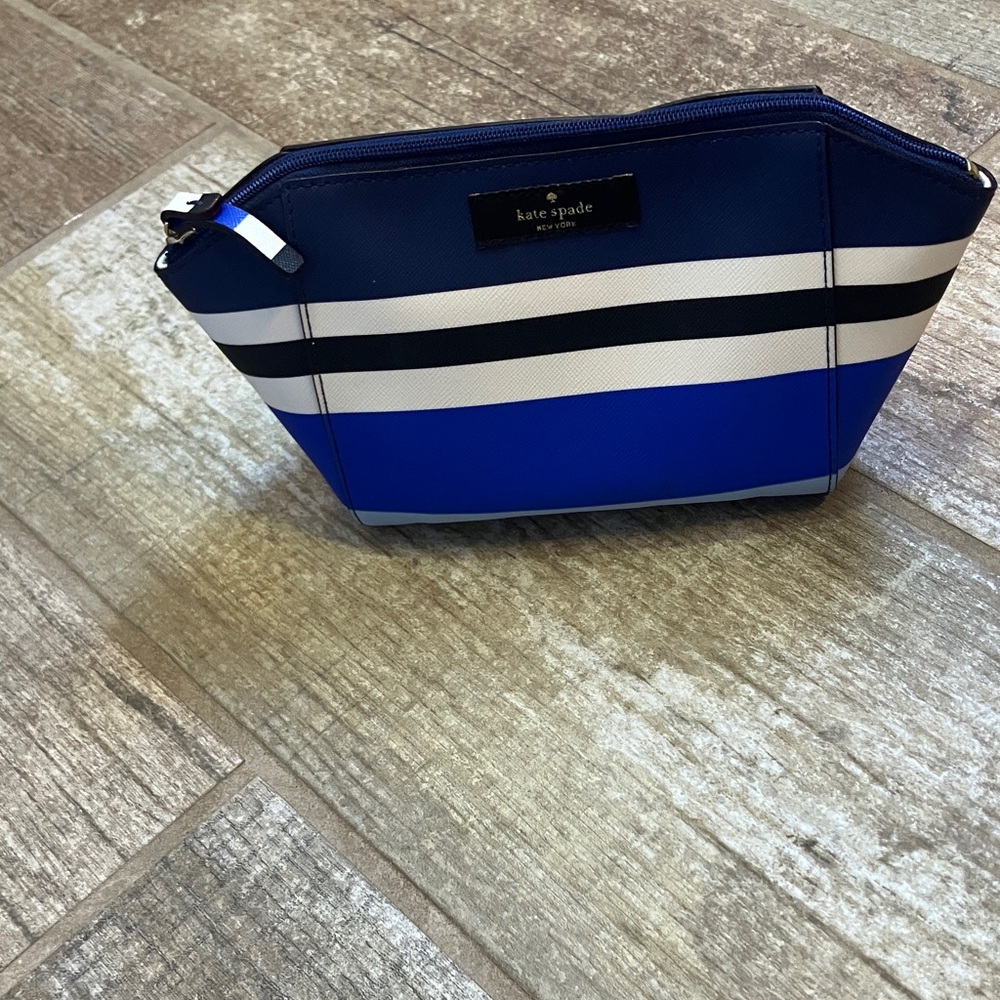 Kate Spade Small Eady Laurel Way striped blue and white cosmetic bag.